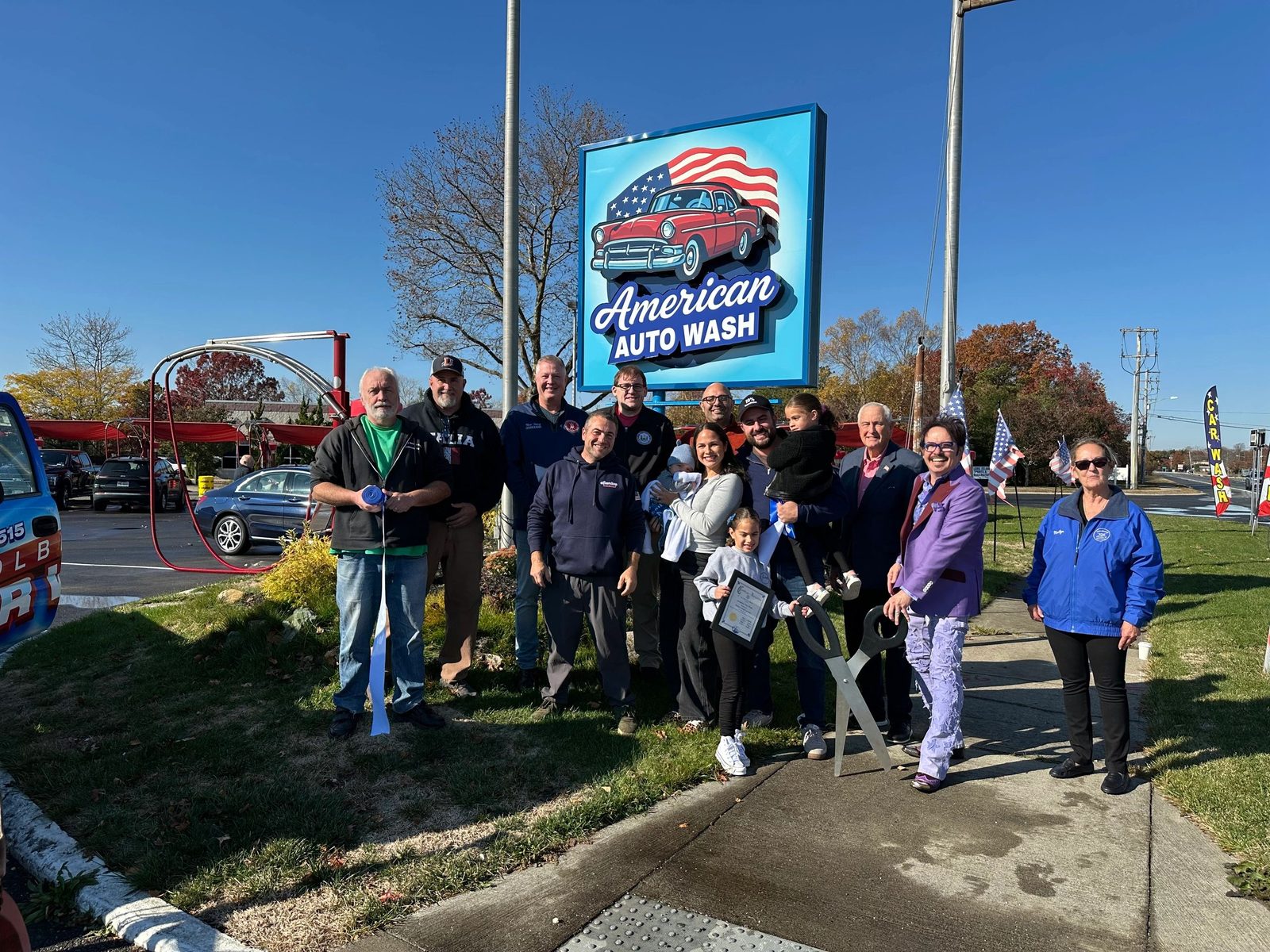American Auto Wash team and the Holbrook wash bay in daylight